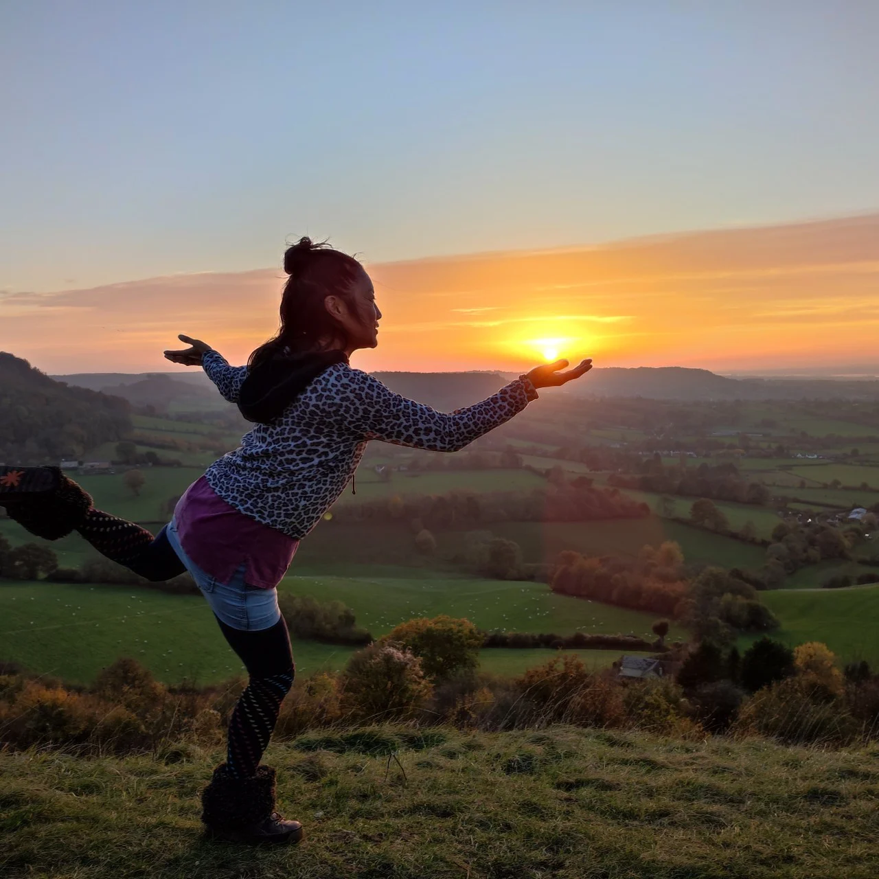 helene su of niio dance, dancing on a hill with sunset, visionary somatic dance