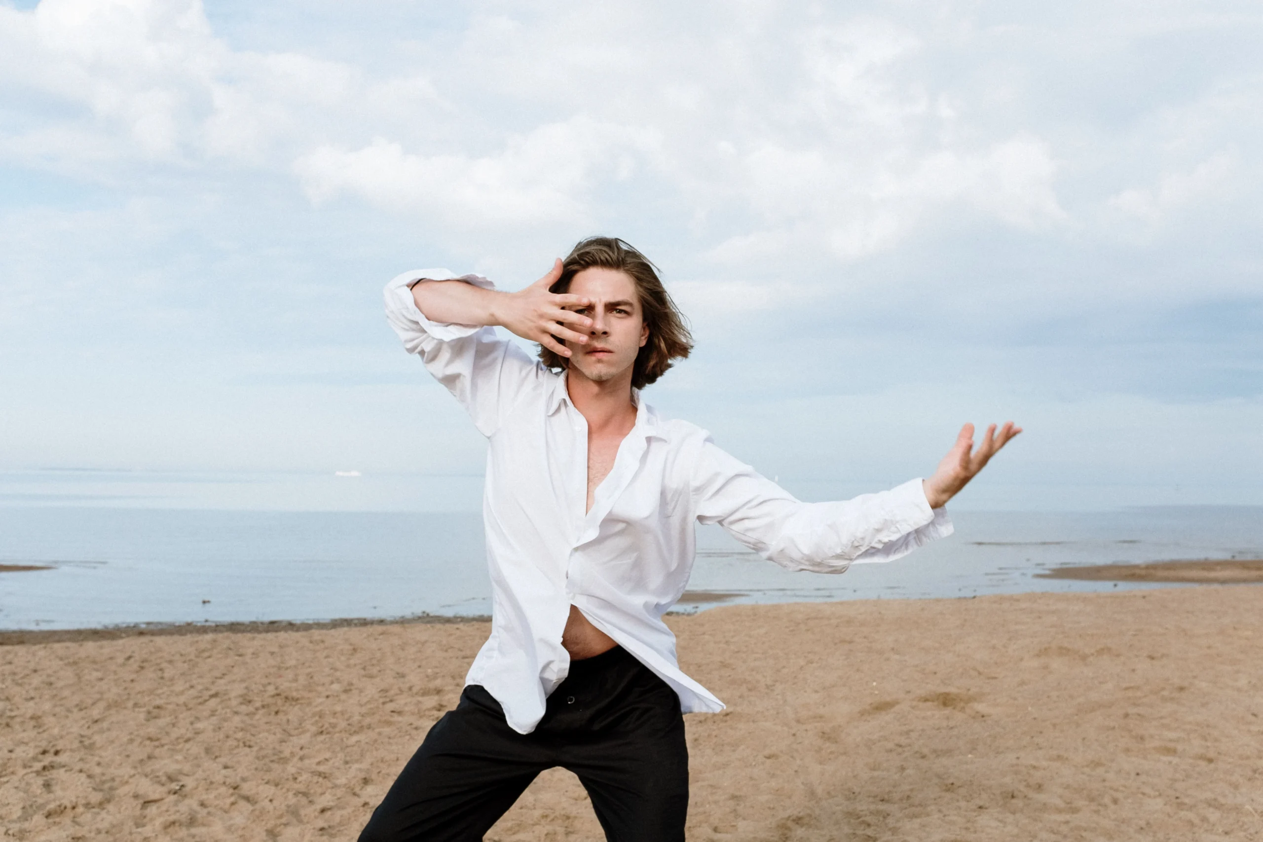 man on the beach expressing boundaries, Niio Dance